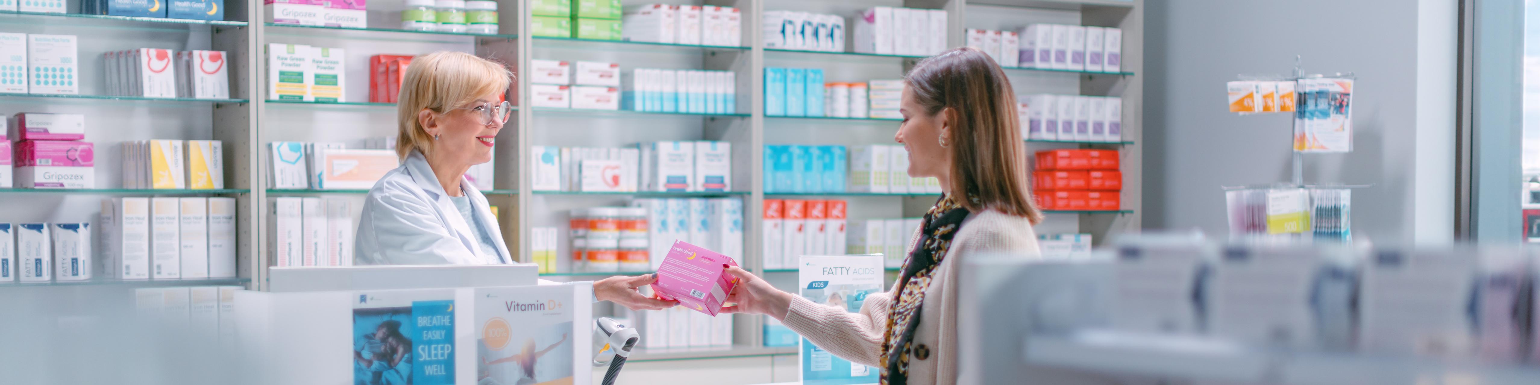 A pharmacist helping a customer in a pharmacy