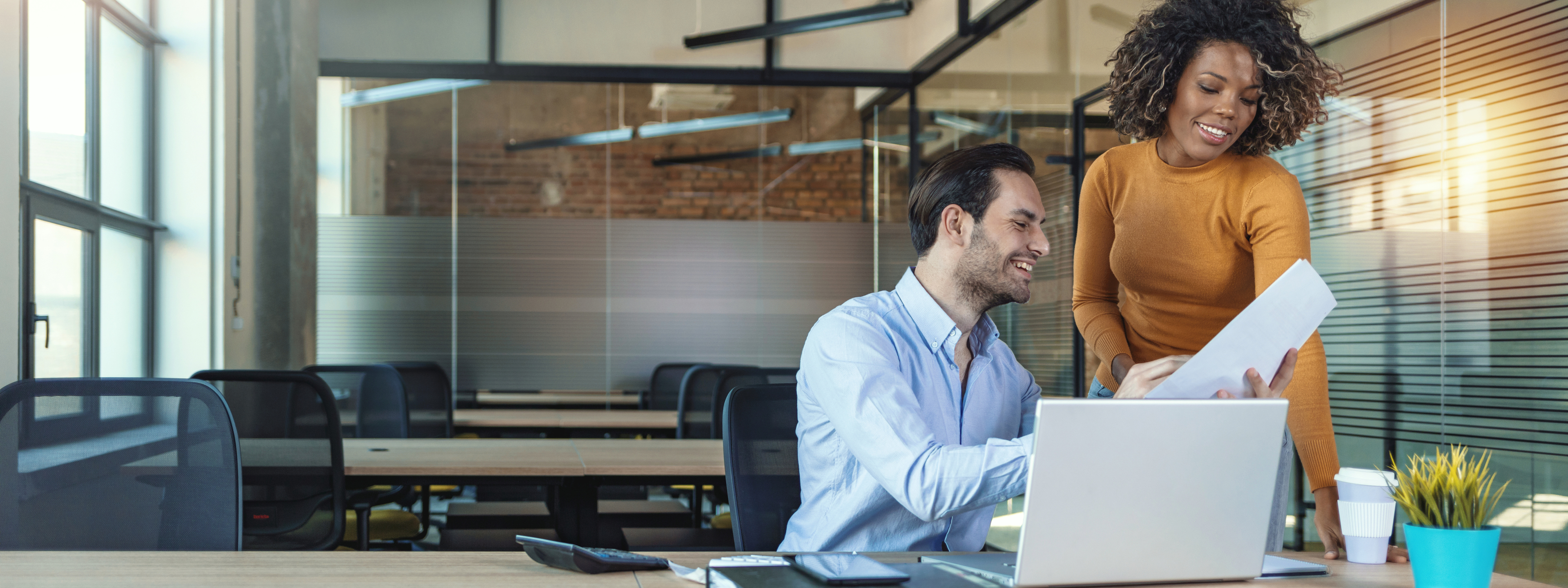 Image of two successful business partners working at meeting in office.