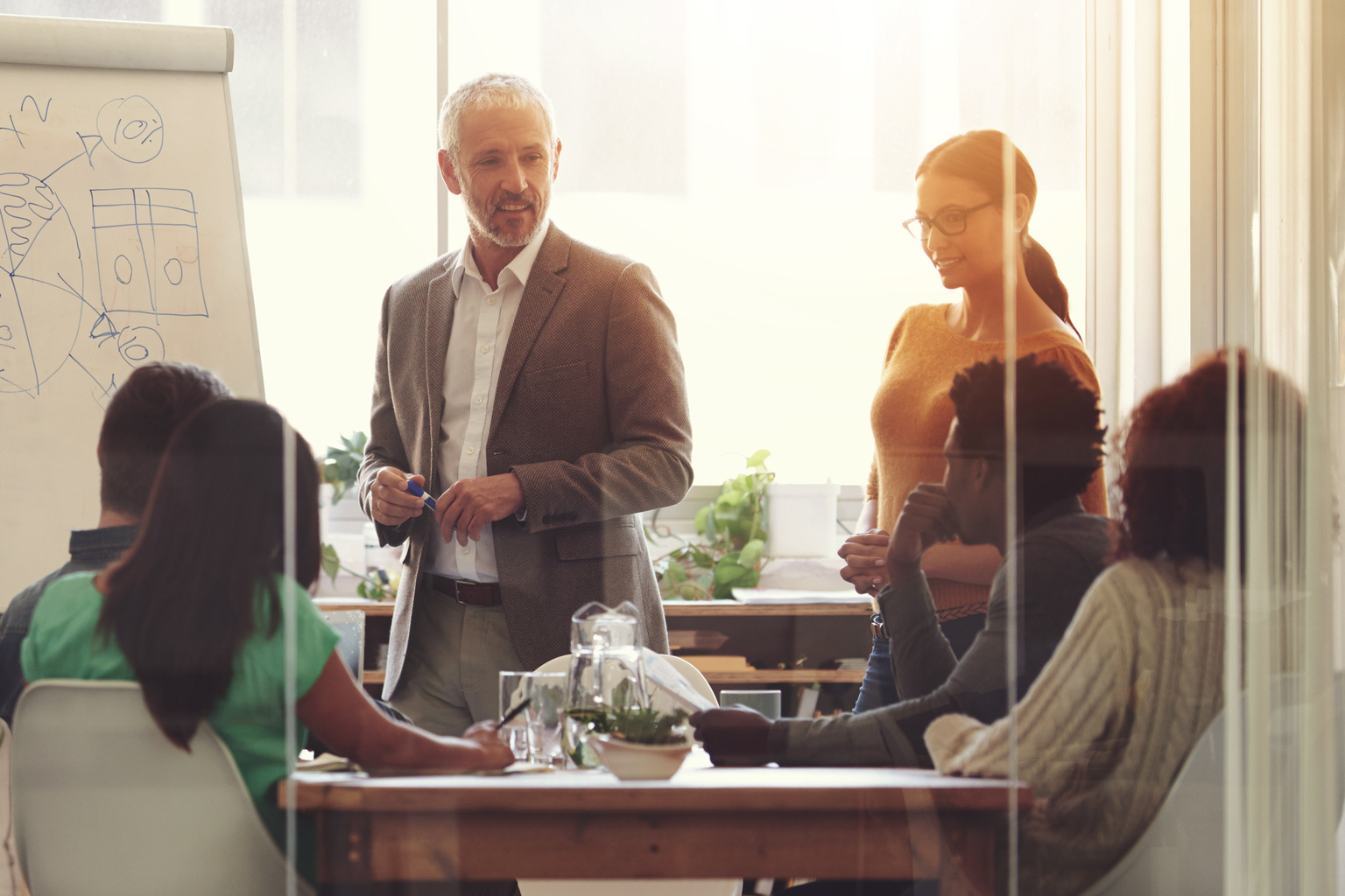 Business people using whiteboard and brainstorming ideas