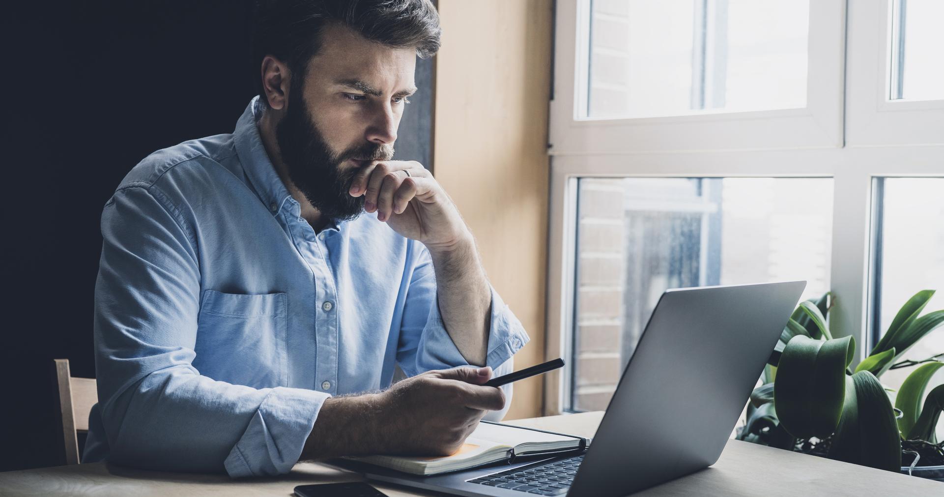 Man studying a computer