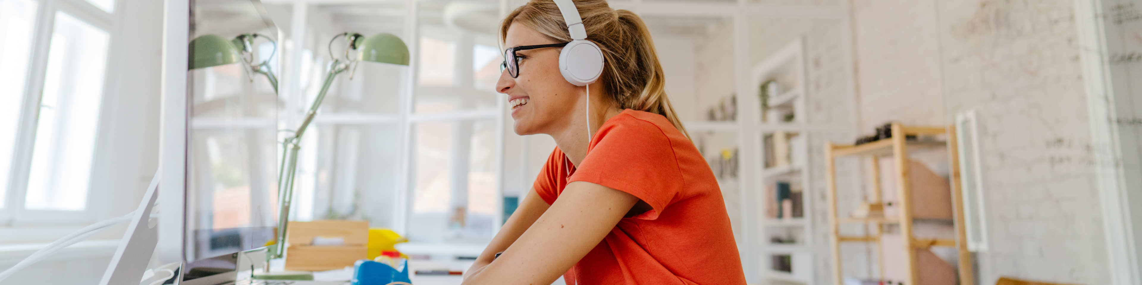 woman videoconferencing with headphones