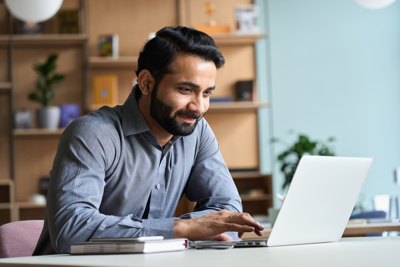 Business man working from laptop in home office