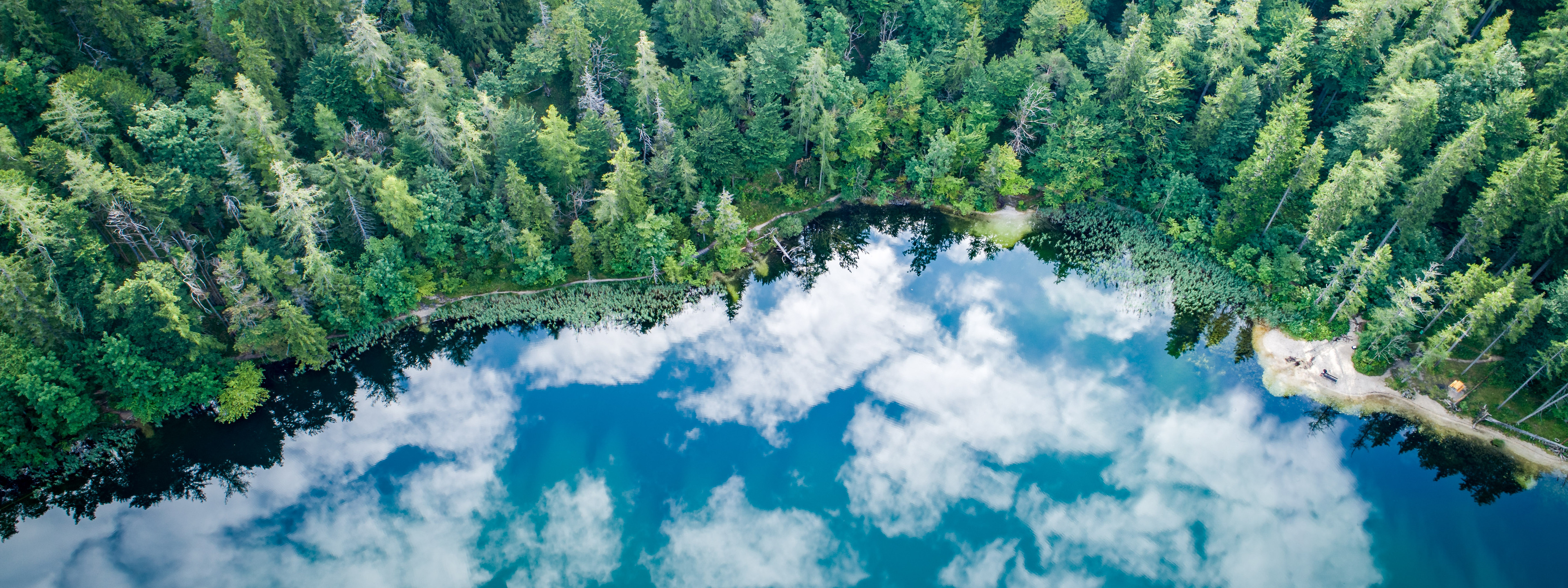 Aerial view at lake Eibensee, a beautiful small mountain lake in the Austrian Alps near Salzburg.