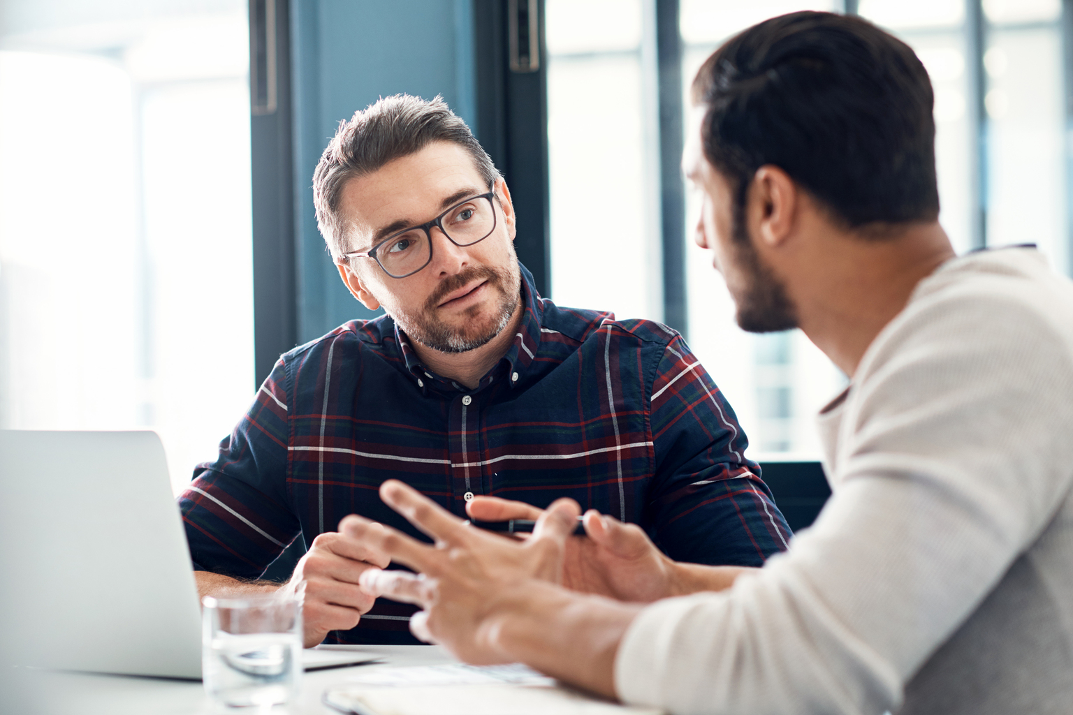 Shot of two businessmen having a discussion in an office