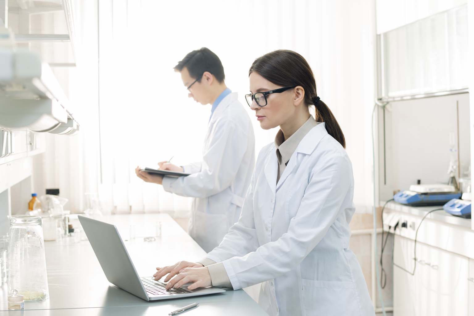pharmacist in lab using tablet