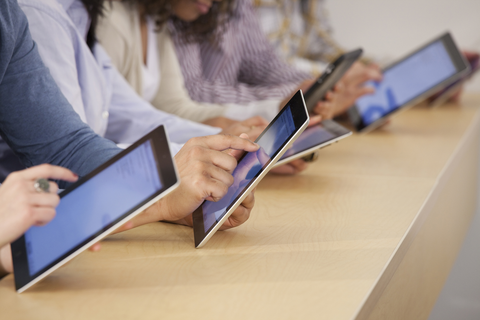 Students using digital tablets