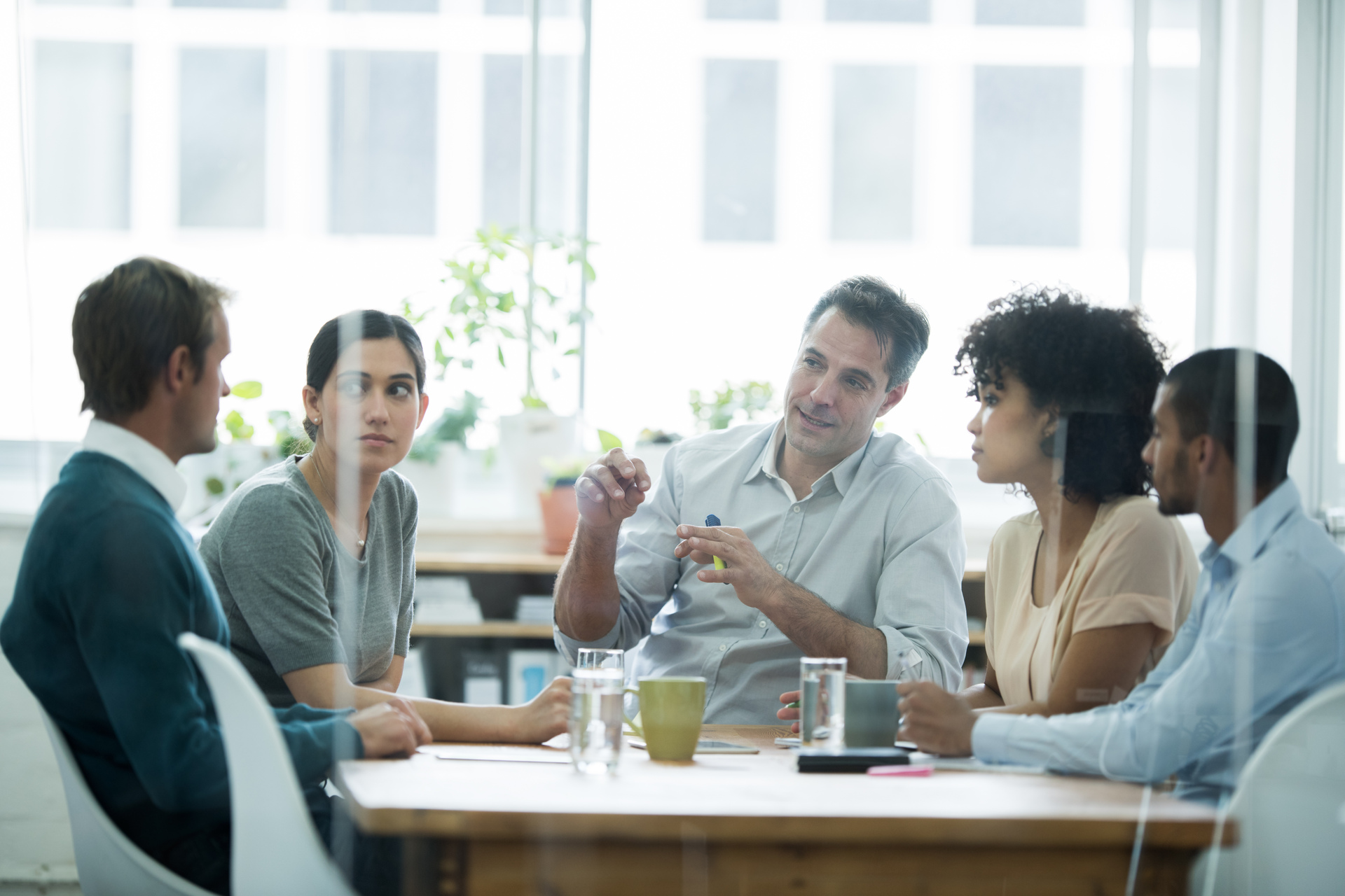 Cropped shot of a group of business colleagues meeting in the boardroom