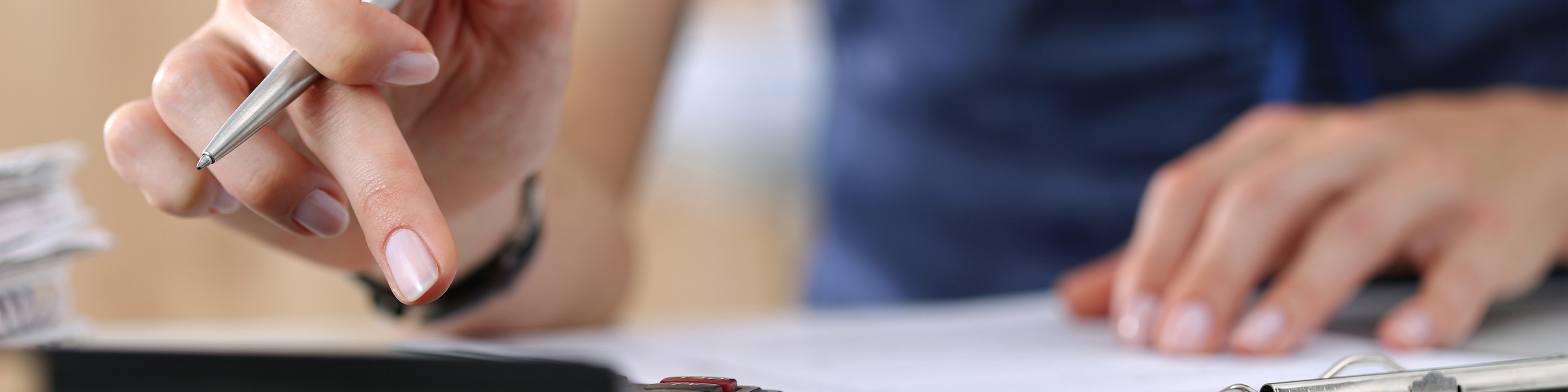 Close up of female accountant or banker making calculations