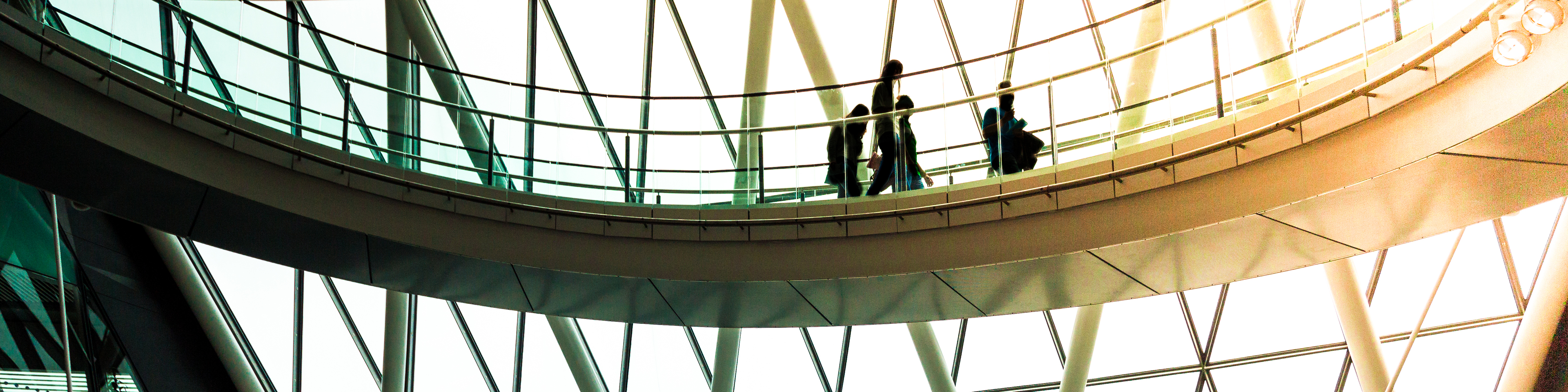 Abstract modern architecture and silhouettes of people on spiral staircase