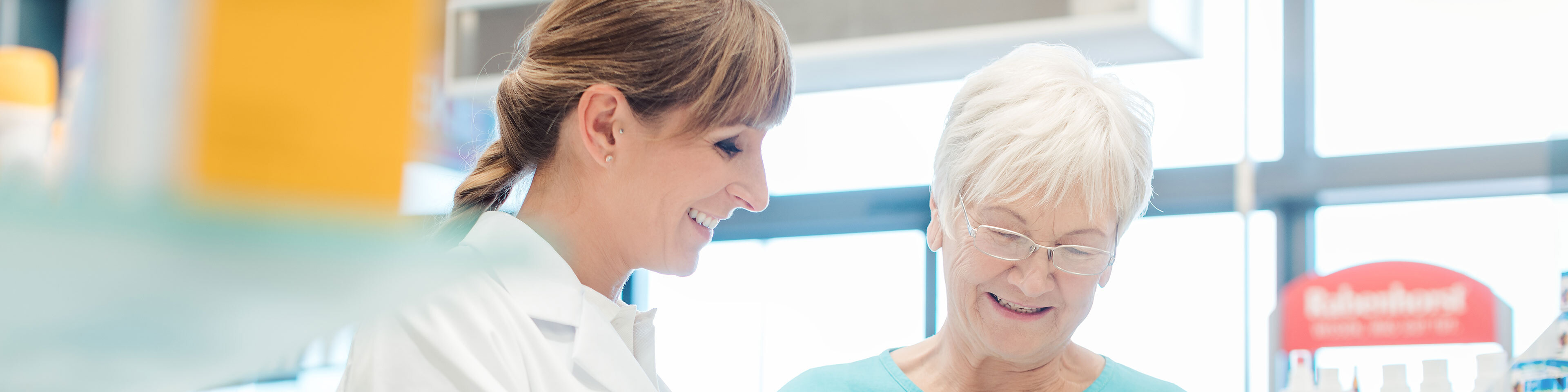 A pharmacist helping a customer to select their durable medical equipment