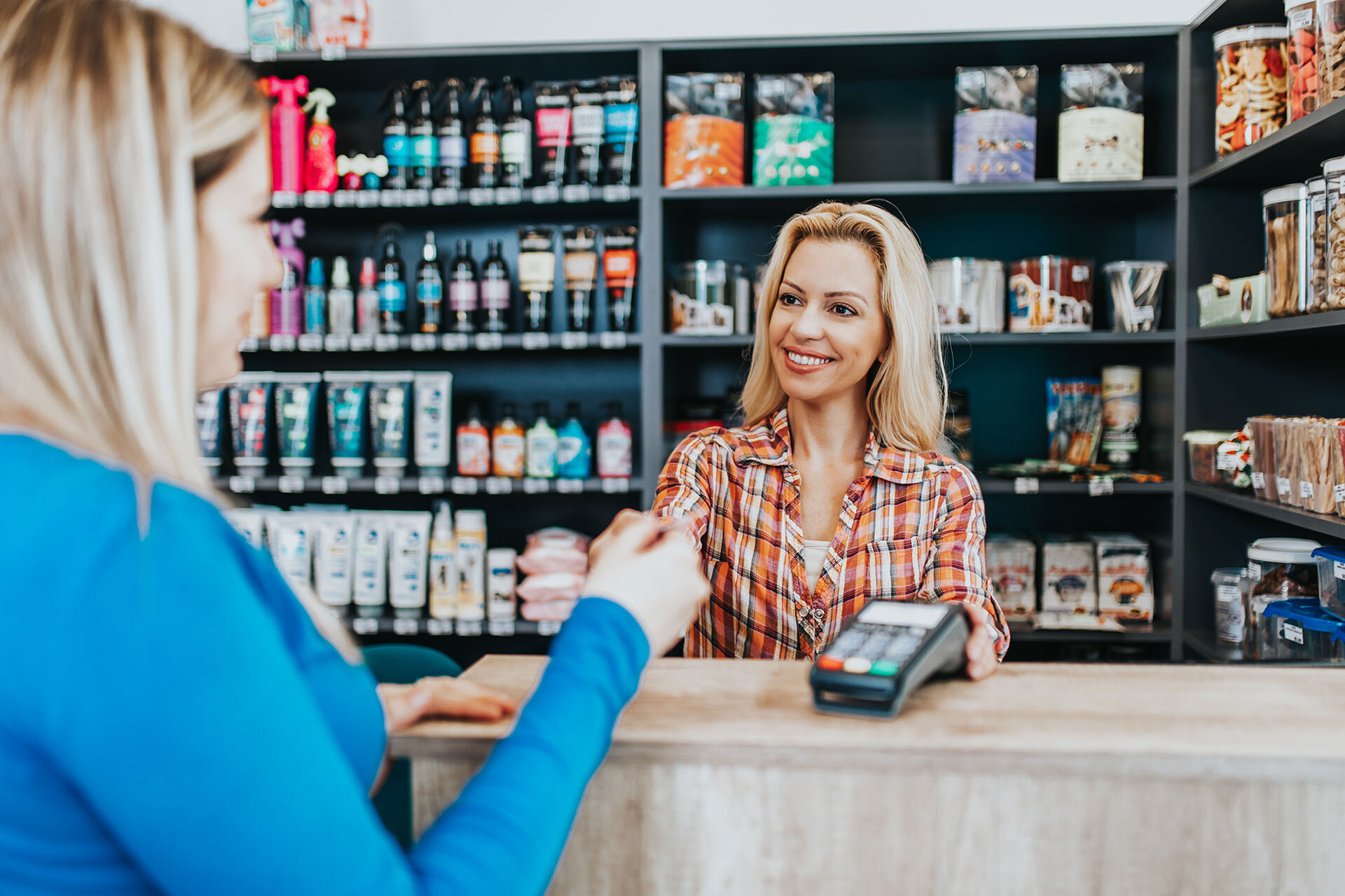 A woman making a purchase in a retail store